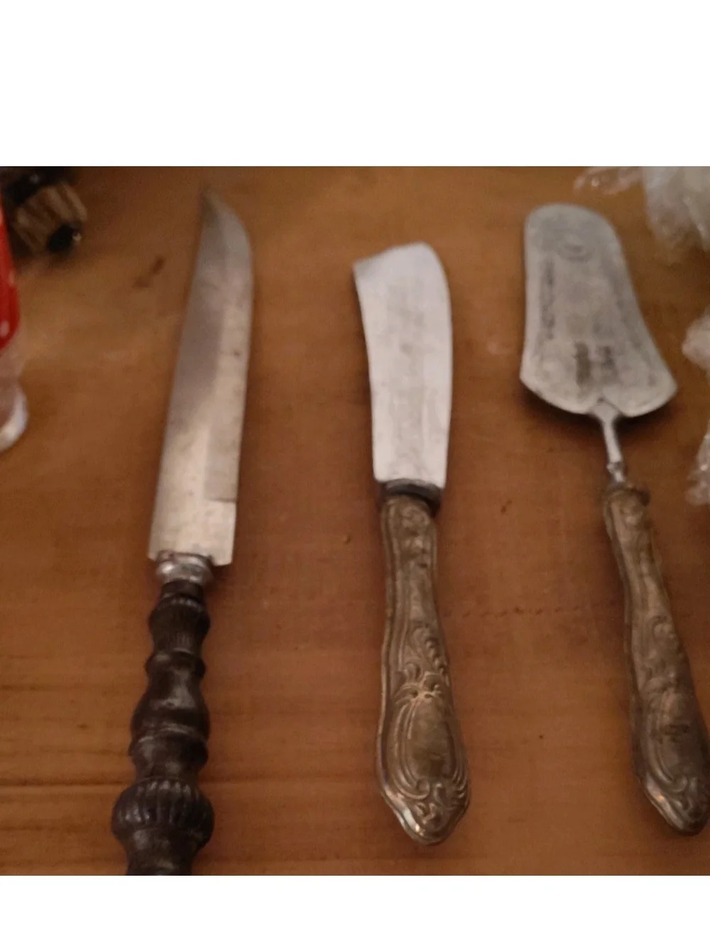 vintage or antique silver-plated cutlery items, likely from a set
